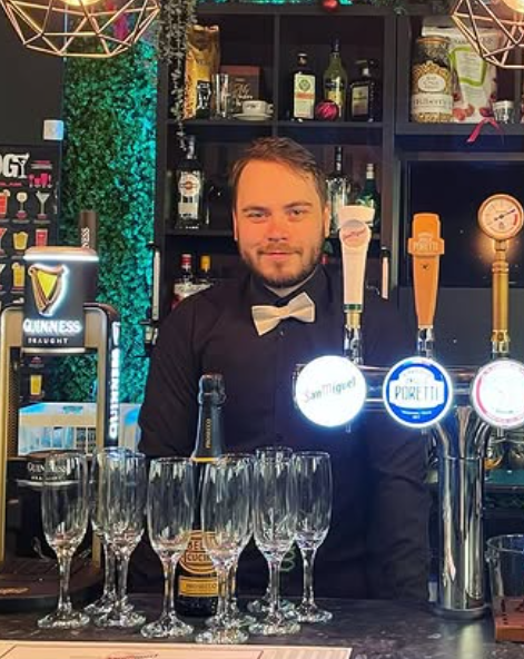 Daniel Comer behind the bar at the restaurant he owned and ran